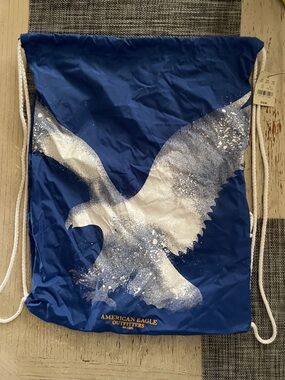 American Eagle Outfitters Royal Blue Drawstring Backpack with White Eagle Print